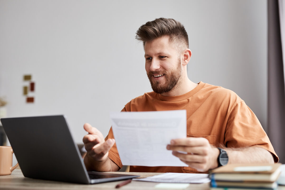 happy young tutor or student with document sitting 2026 01 08 06 54 24 utc.jpg