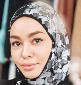 smiling young woman making sketches of islamic fas 2022 03 25 18 55 43 utc cropped.jpg